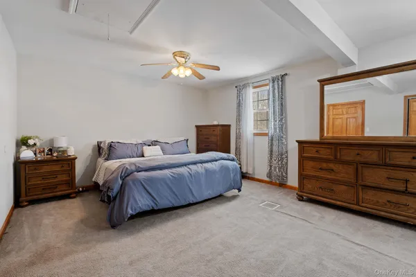 a bathroom with a sink vanity and a mirror