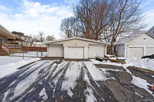 a bathroom with a granite countertop toilet sink and mirror