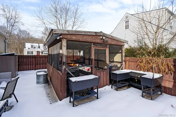 a backyard of a house with cars parked
