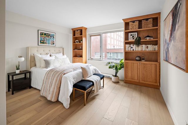 a bedroom with a bed and a cabinets