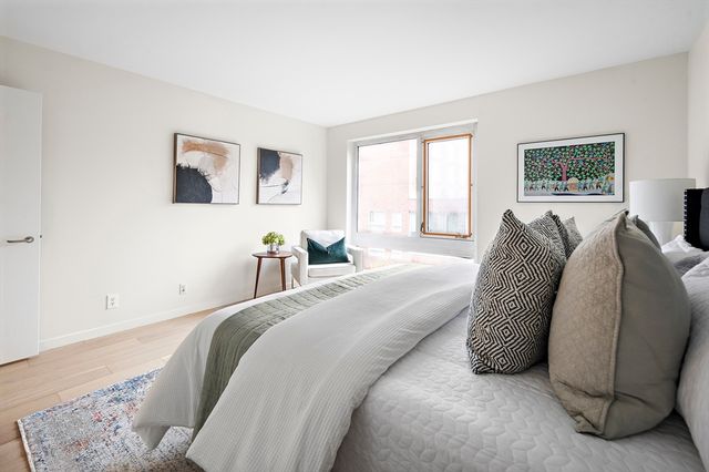 a bed room with a bed and a couch