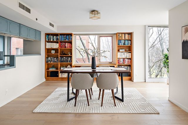 a dining room with furniture and window