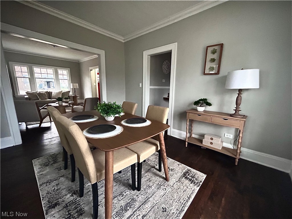 2563 Overlook Road Cleveland, OH 44106 - Photo 18 of 32 Dining space featuring dark hardwood / wood-style floors and ornamental molding