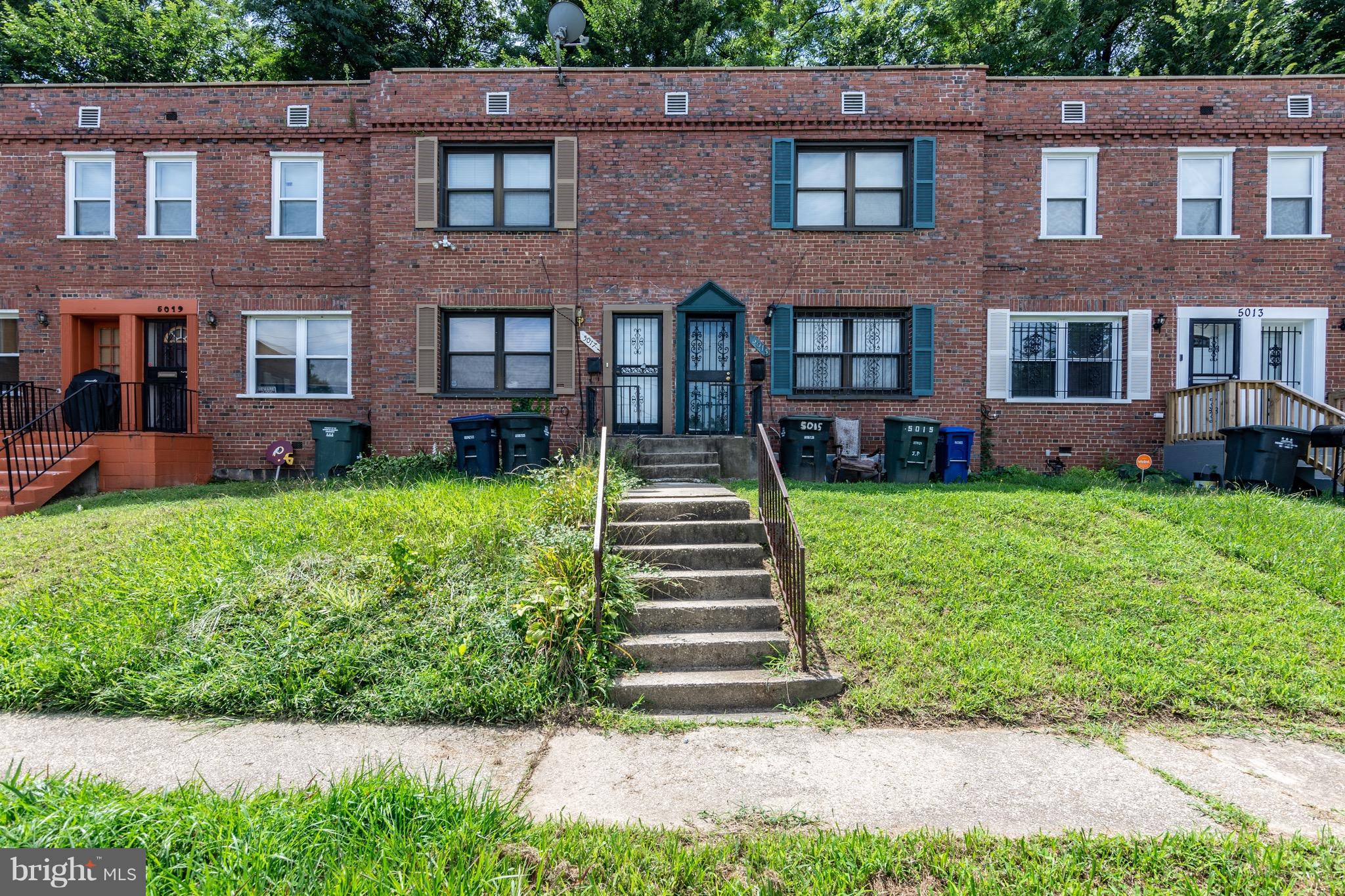 5017 Sheriff Road Northeast Washington, DC 20019 - Photo 1 of 22 a front view of a building with garden