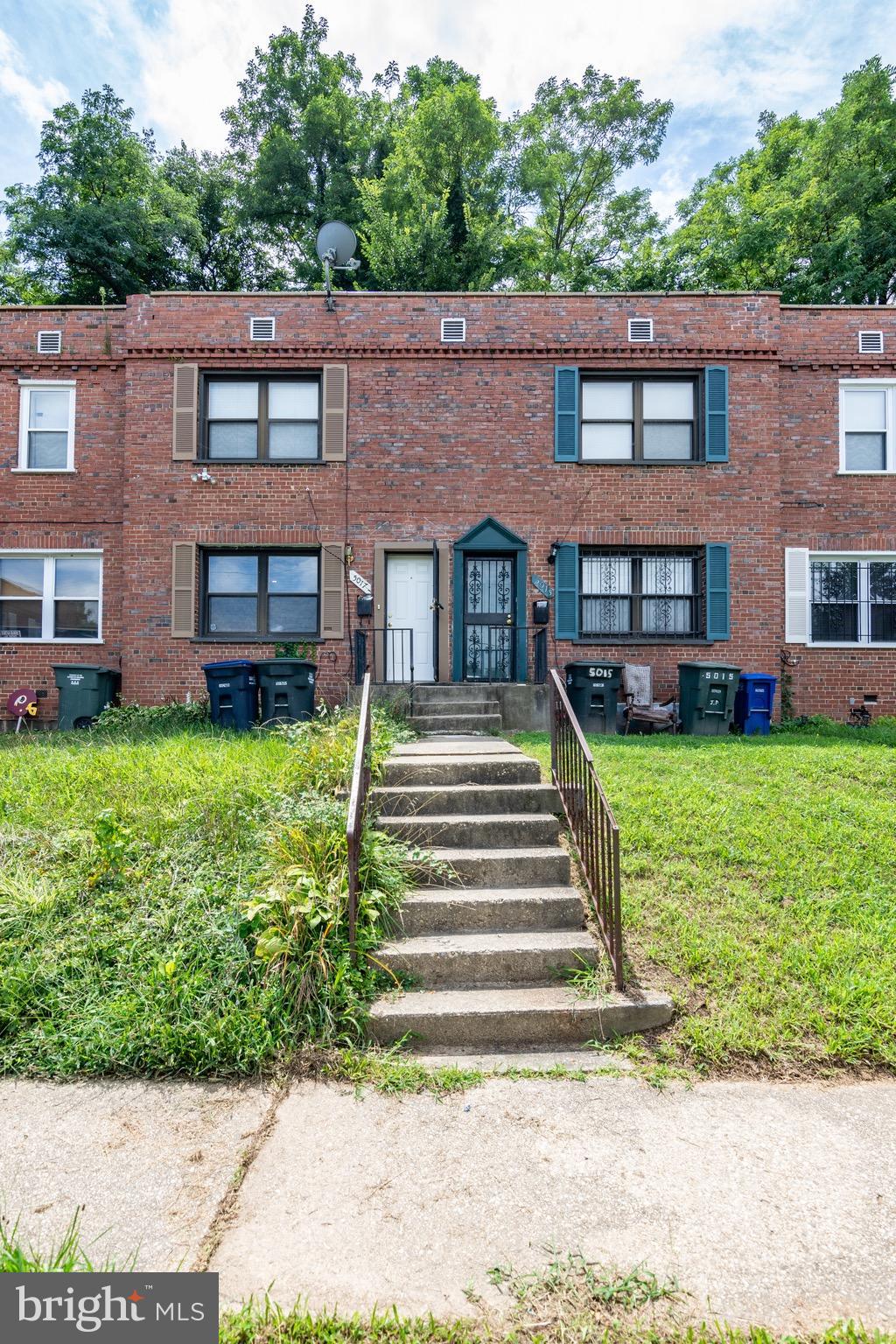 5017 Sheriff Road Northeast Washington, DC 20019 - Photo 22 of 22 a front view of a house with garden