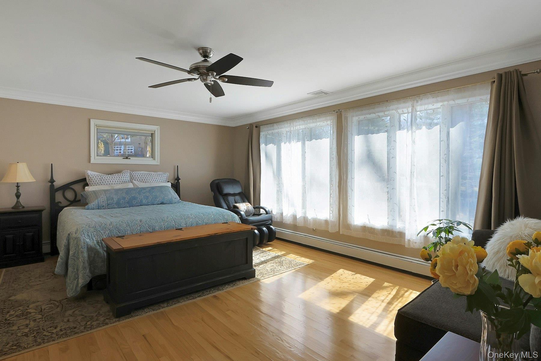 27 Deerpath Road Tuxedo Park, NY 10987 - Photo 17 of 32 a bedroom with a bed and windows