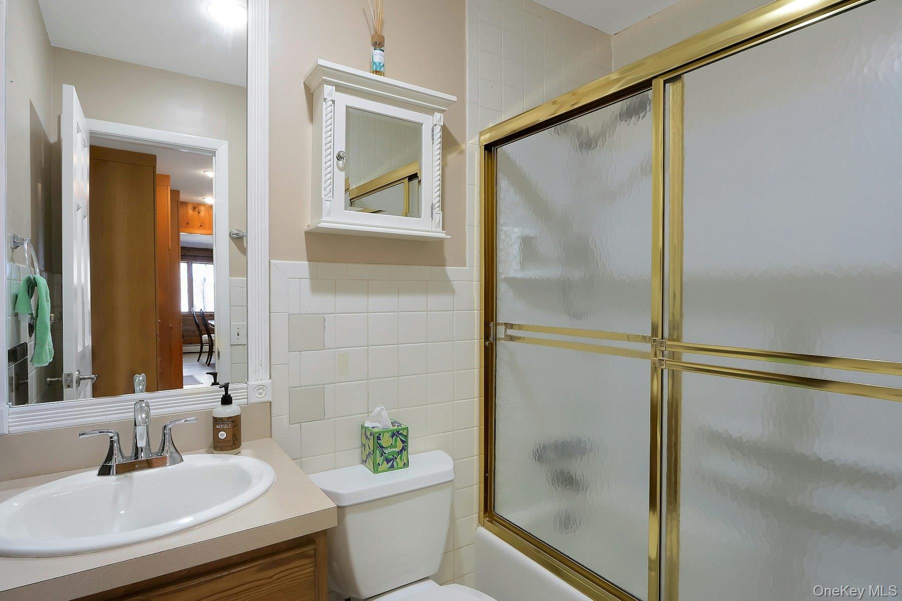 27 Deerpath Road Tuxedo Park, NY 10987 - Photo 20 of 32 a bathroom with a shower and a sink