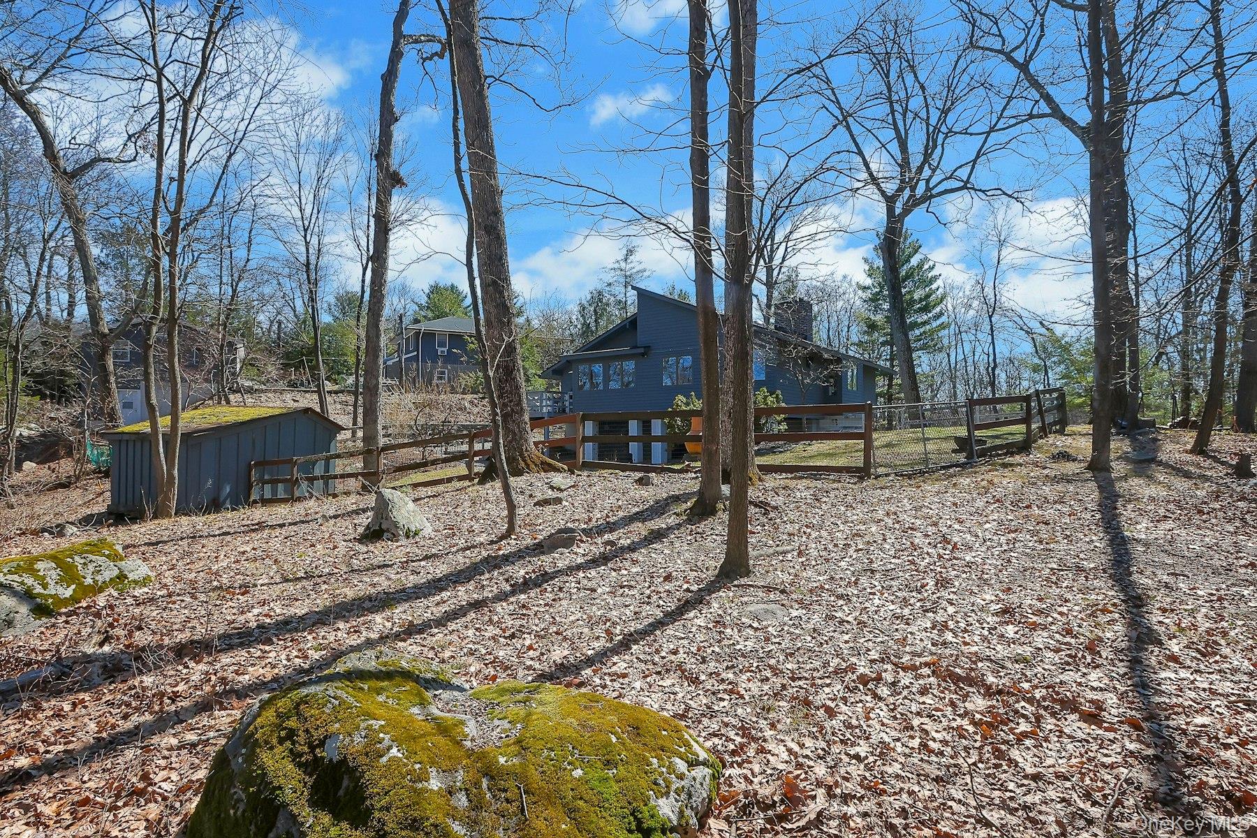 27 Deerpath Road Tuxedo Park, NY 10987 - Photo 25 of 32 a view of a swimming pool with a patio
