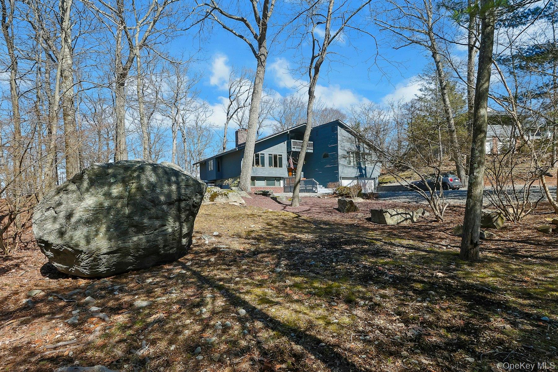 27 Deerpath Road Tuxedo Park, NY 10987 - Photo 26 of 32 a view of a house with a yard