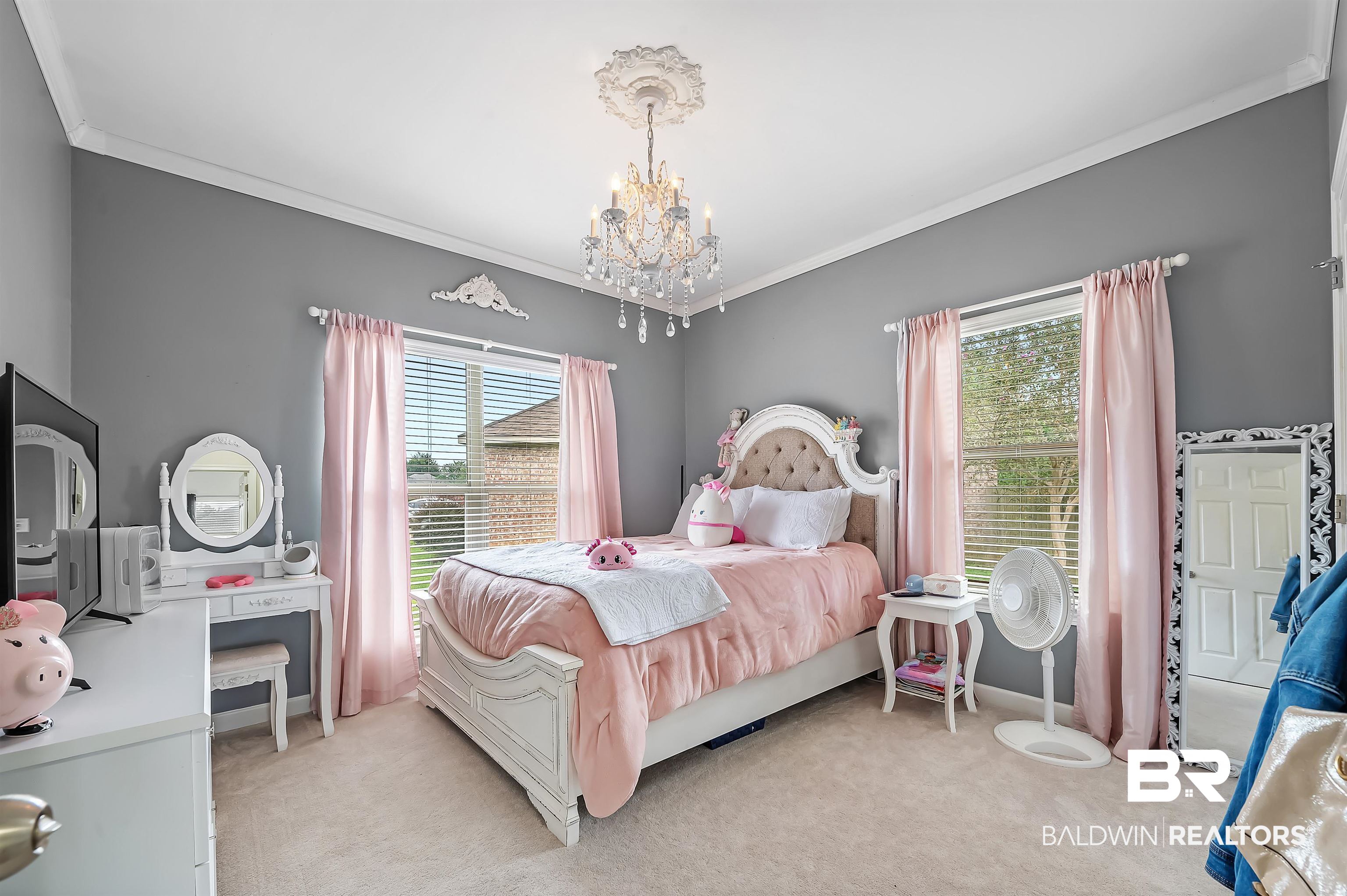 9376 Sable Court Daphne, AL 36526 - Photo 31 of 46 Carpeted bedroom featuring a chandelier and crown molding
