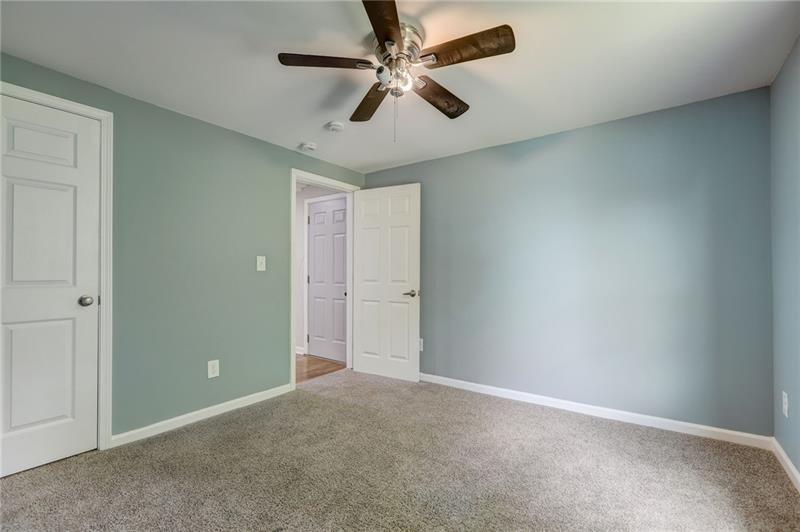 807 A Gilbert Street Southeast, Unit A Atlanta, GA 30316 - Photo 13 of 25 an empty room with windows and fan