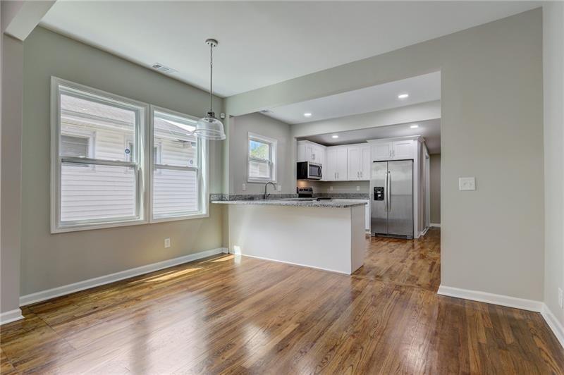 807 A Gilbert Street Southeast, Unit A Atlanta, GA 30316 - Photo 6 of 25 a view of kitchen with refrigerator microwave and stove