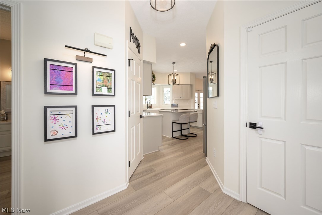 3912 Raintree Circle Uniontown, OH 44685 - Photo 16 of 49 Hall featuring light LVP flooring and recessed lighting
