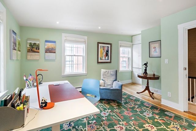 a living room with furniture rug and window