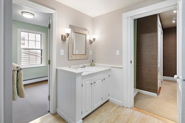 a bathroom with a sink a mirror and a shower