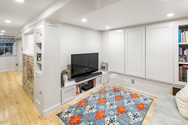 a room with furniture and a flat screen tv