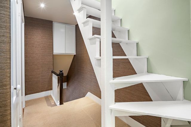 a balcony with furniture and flowers