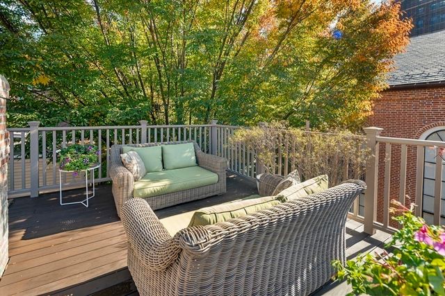 a view of a balcony with furniture