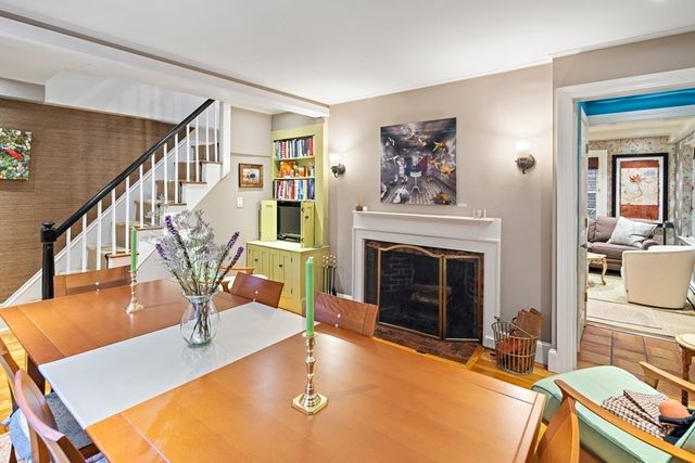 a living room with fireplace furniture and a fireplace