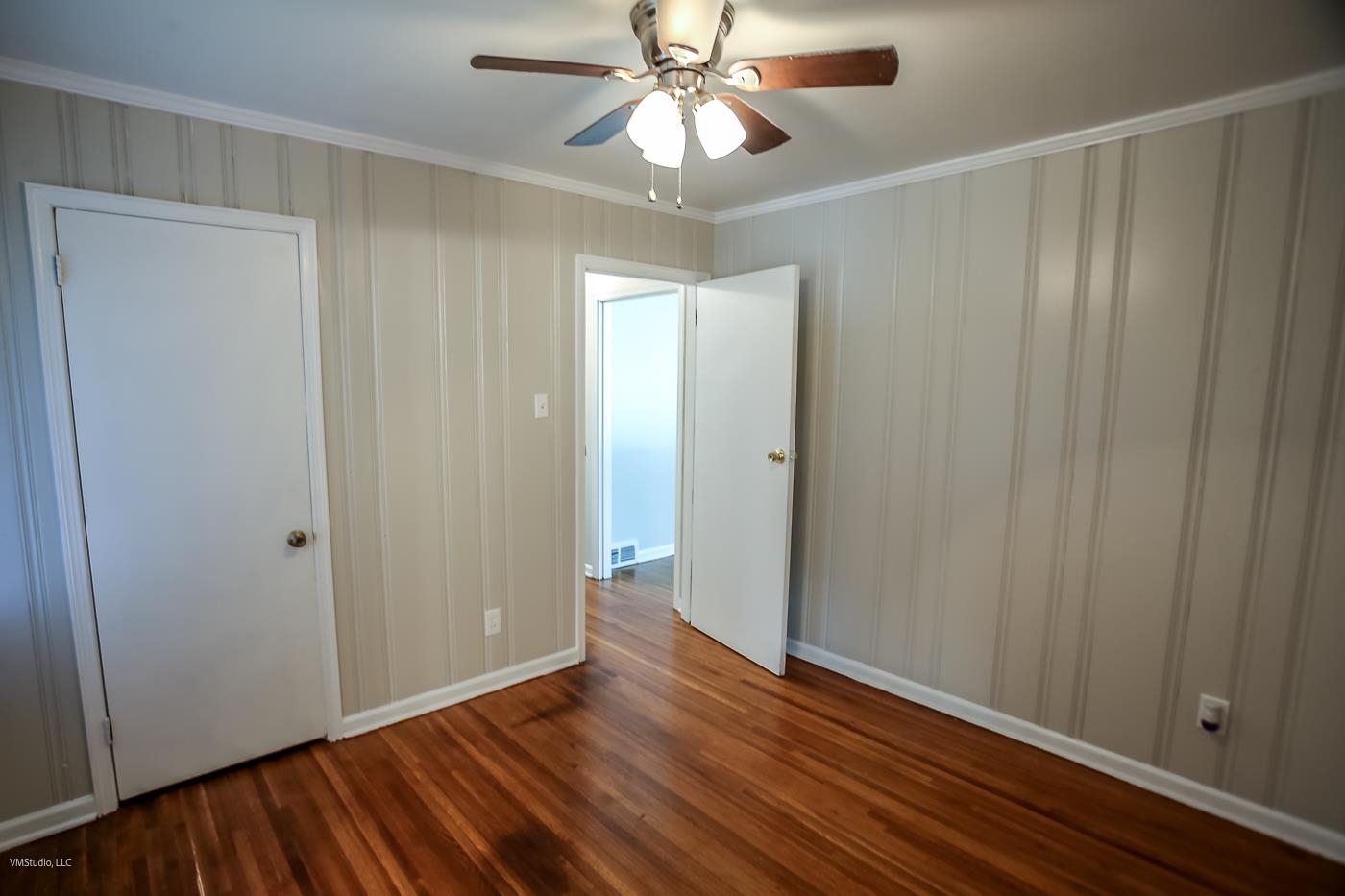 1654 Cranford Road Memphis, TN 38117 - Photo 12 of 25 an empty room with wooden floor closet and windows