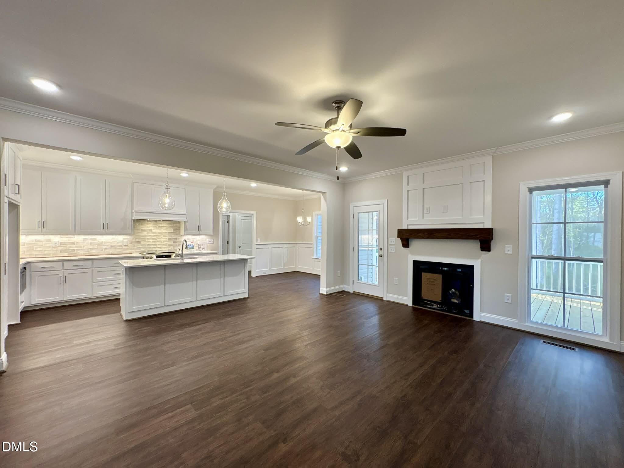 800 Emmett Ct Spring Spring Hope, NC 27882 - Photo 14 of 62 a view of an empty room with a fireplace and wooden floor