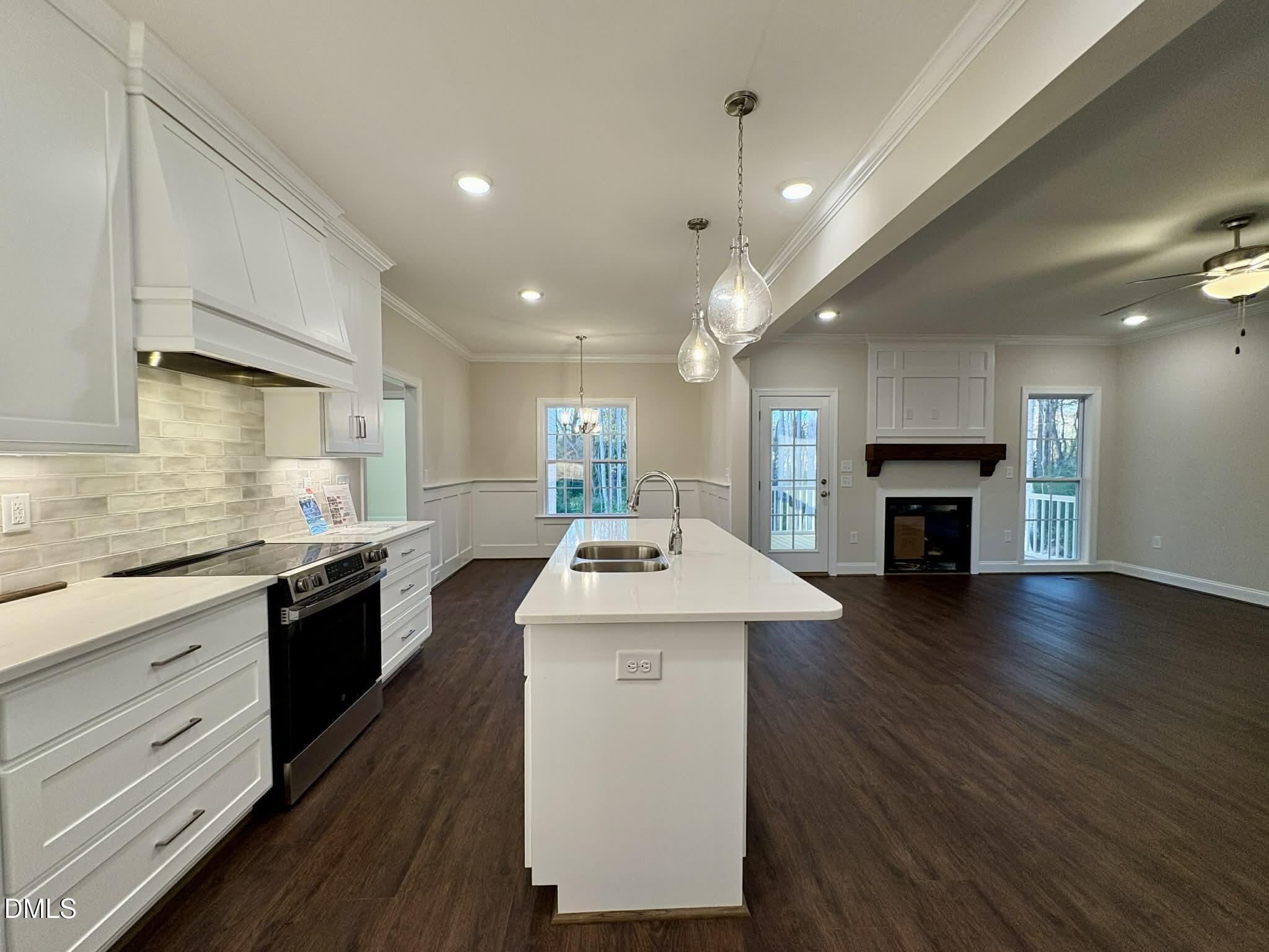 800 Emmett Ct Spring Spring Hope, NC 27882 - Photo 15 of 62 a kitchen with sink cabinets and wooden floor