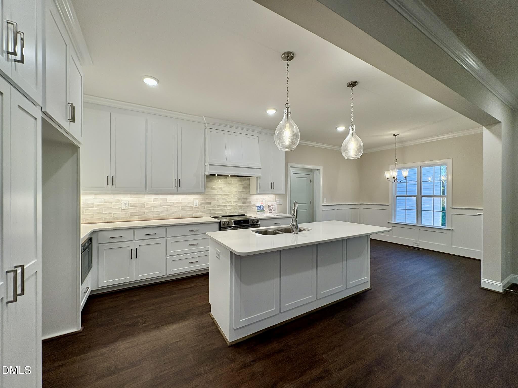 800 Emmett Ct Spring Spring Hope, NC 27882 - Photo 17 of 62 a kitchen that has a lot of white cabinets and stainless steel appliances