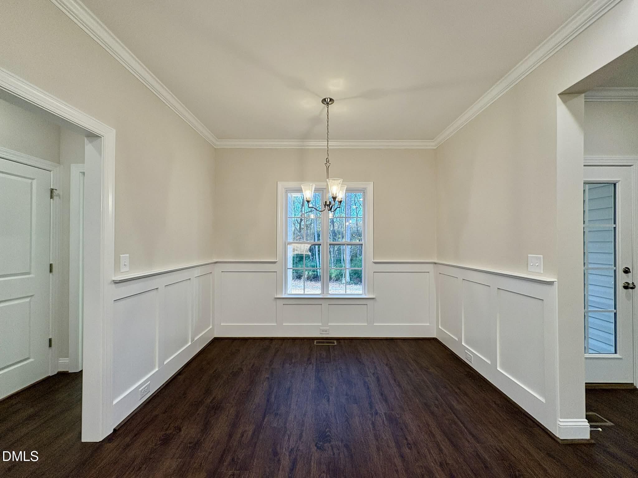 800 Emmett Ct Spring Spring Hope, NC 27882 - Photo 25 of 62 a view of an empty room with wooden floor and a window