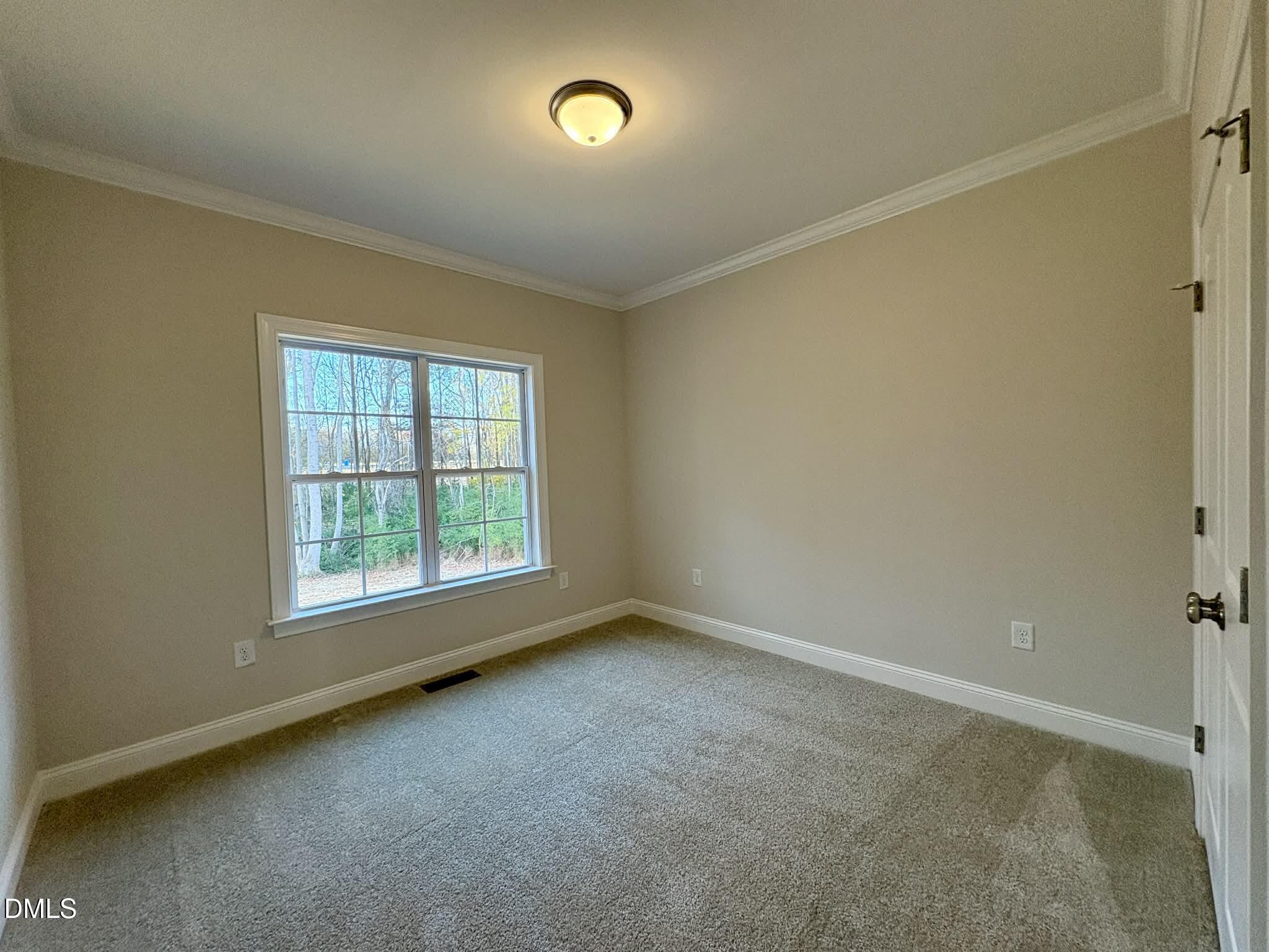 800 Emmett Ct Spring Spring Hope, NC 27882 - Photo 41 of 62 an empty room with a window