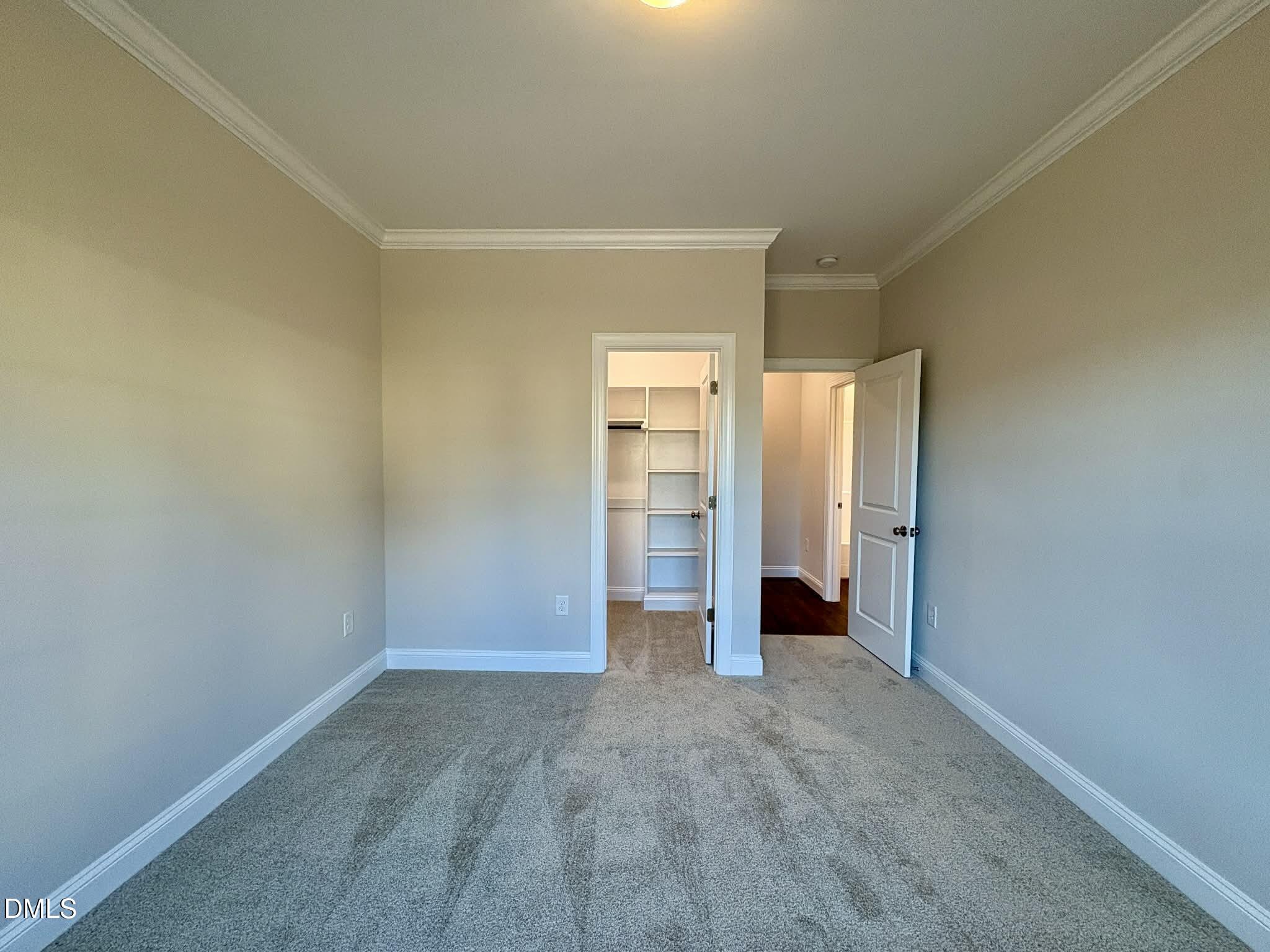 800 Emmett Ct Spring Spring Hope, NC 27882 - Photo 45 of 62 an empty room with closet and wooden door