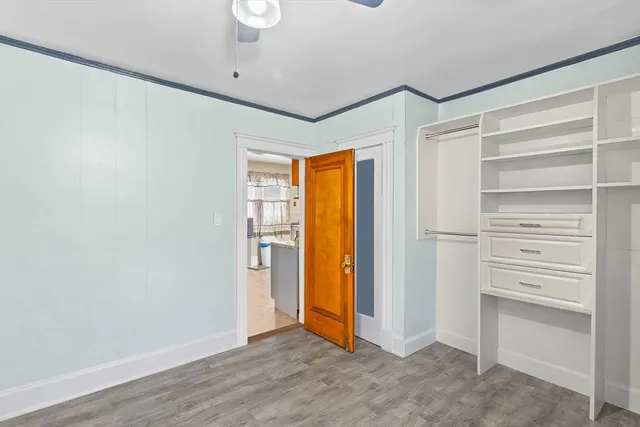a view of walk in closet with empty racks
