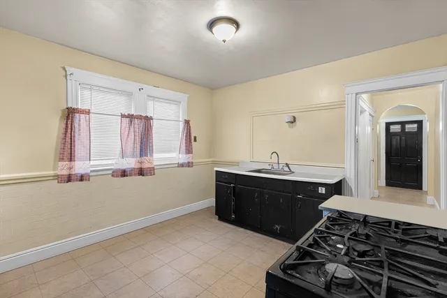 a room with a bed and a window