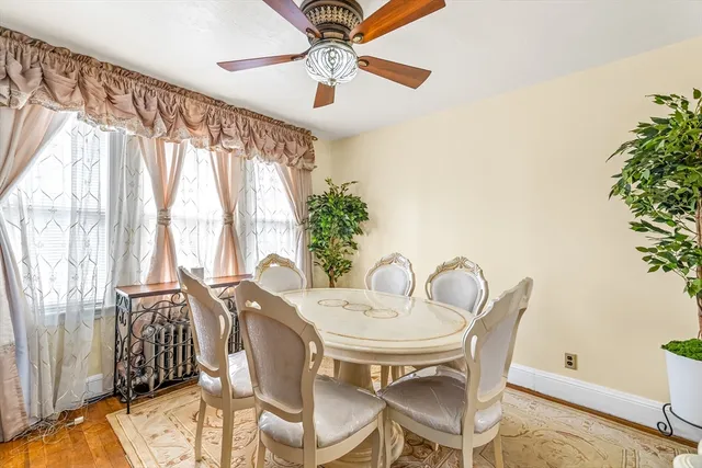 a dining room with furniture and window