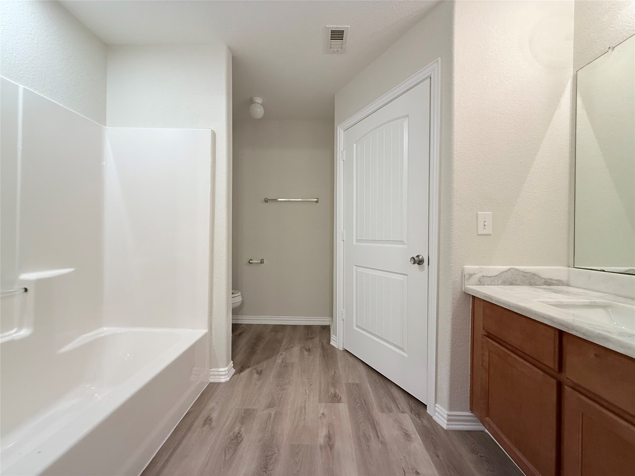 3907 Faulkner Street Houston, TX 77021 - Photo 12 of 17 a bathroom with a granite countertop sink a toilet and shower