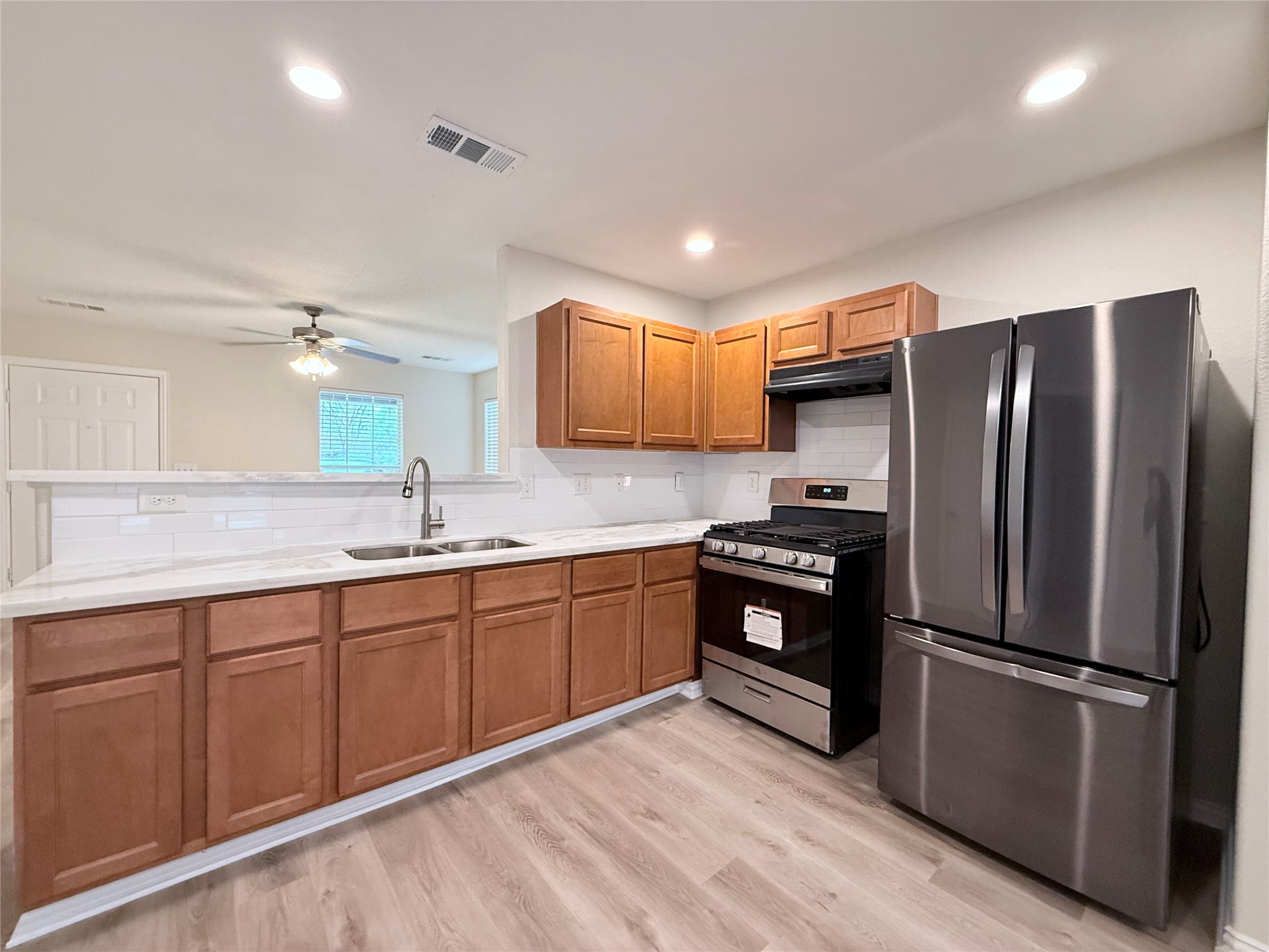 3907 Faulkner Street Houston, TX 77021 - Photo 8 of 17 a kitchen with stainless steel appliances granite countertop a refrigerator stove and sink