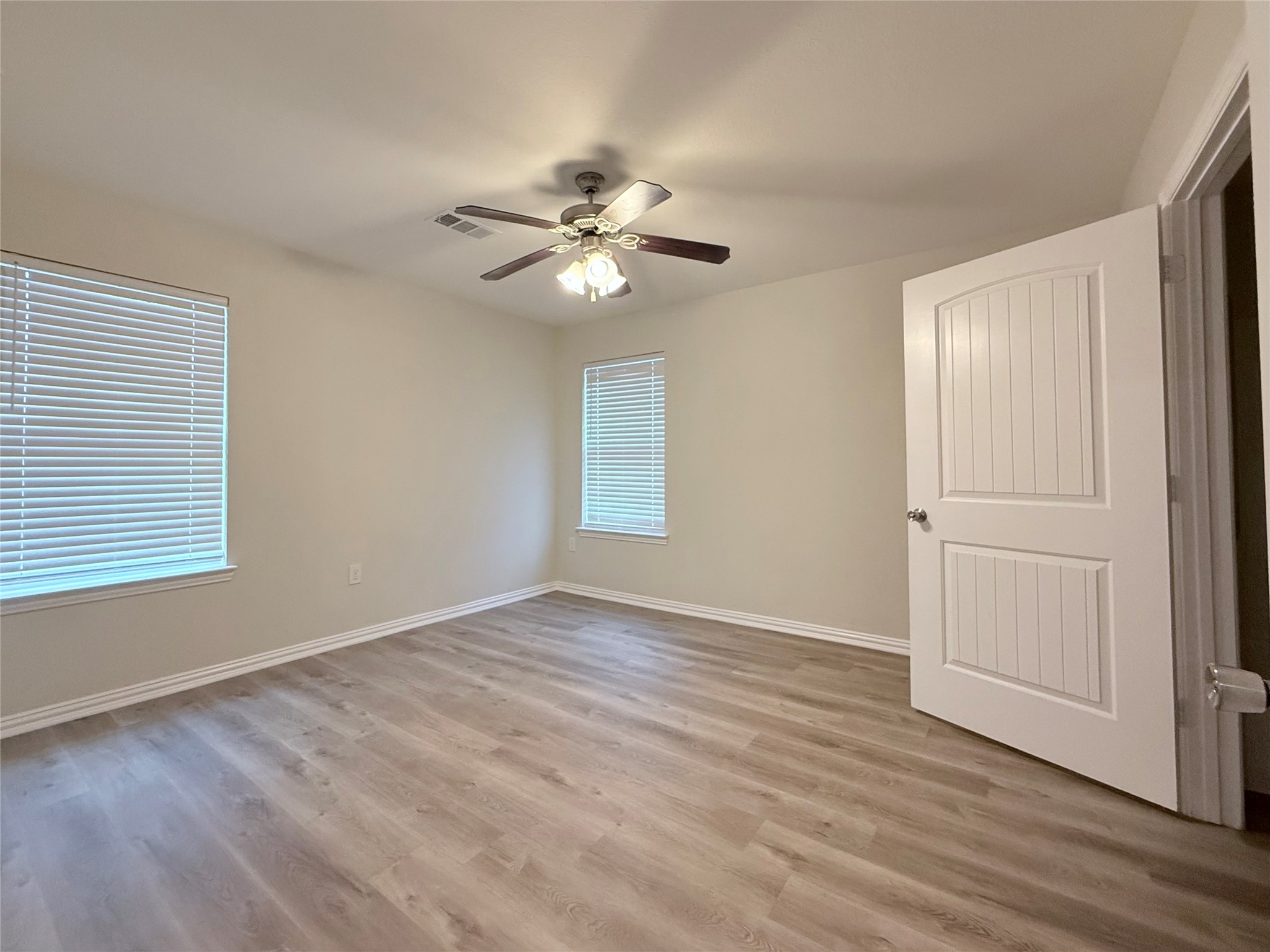 3907 Faulkner Street Houston, TX 77021 - Photo 10 of 17 wooden floor in an empty room with a window