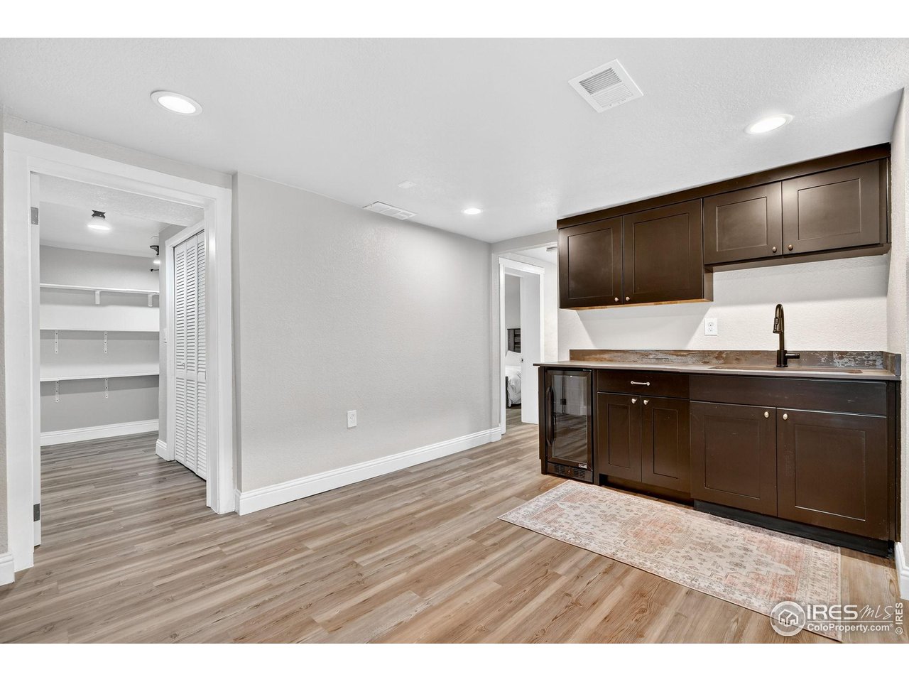2065 Holly Street Denver, CO 80207 - Photo 20 of 46 Wet Bar and beverage fridge could be "mini guest kitchen"