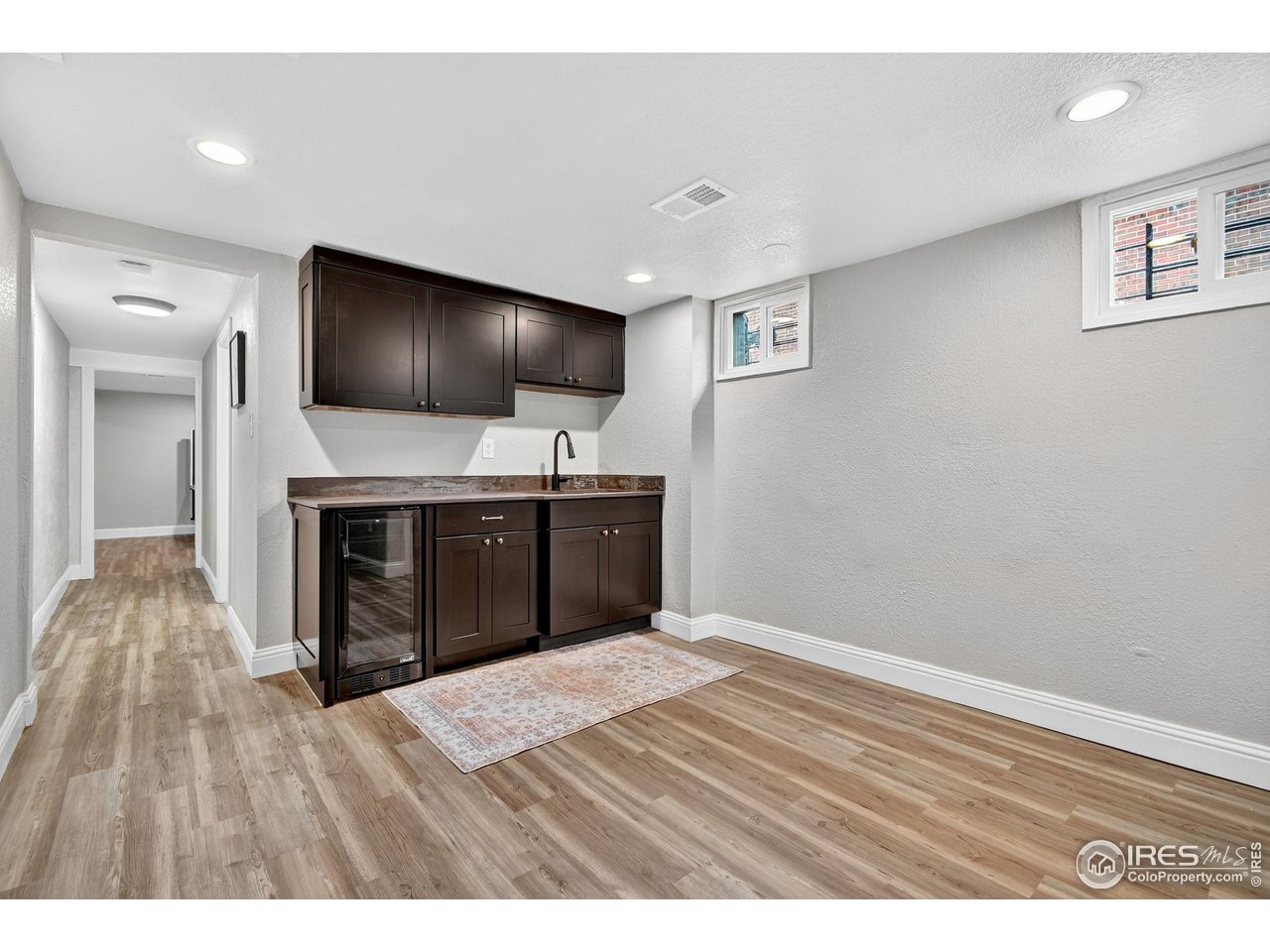 2065 Holly Street Denver, CO 80207 - Photo 23 of 46 Wet Bar and beverage fridge could be "mini guest kitchen"