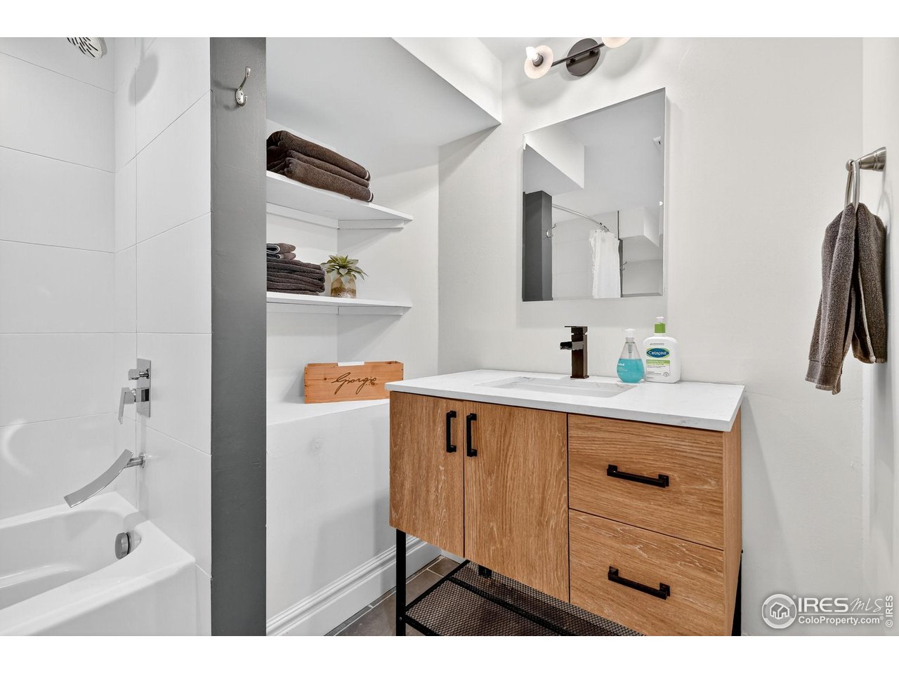 2065 Holly Street Denver, CO 80207 - Photo 26 of 46 Large Remodeled Basement Bath with custom fixtures and tile