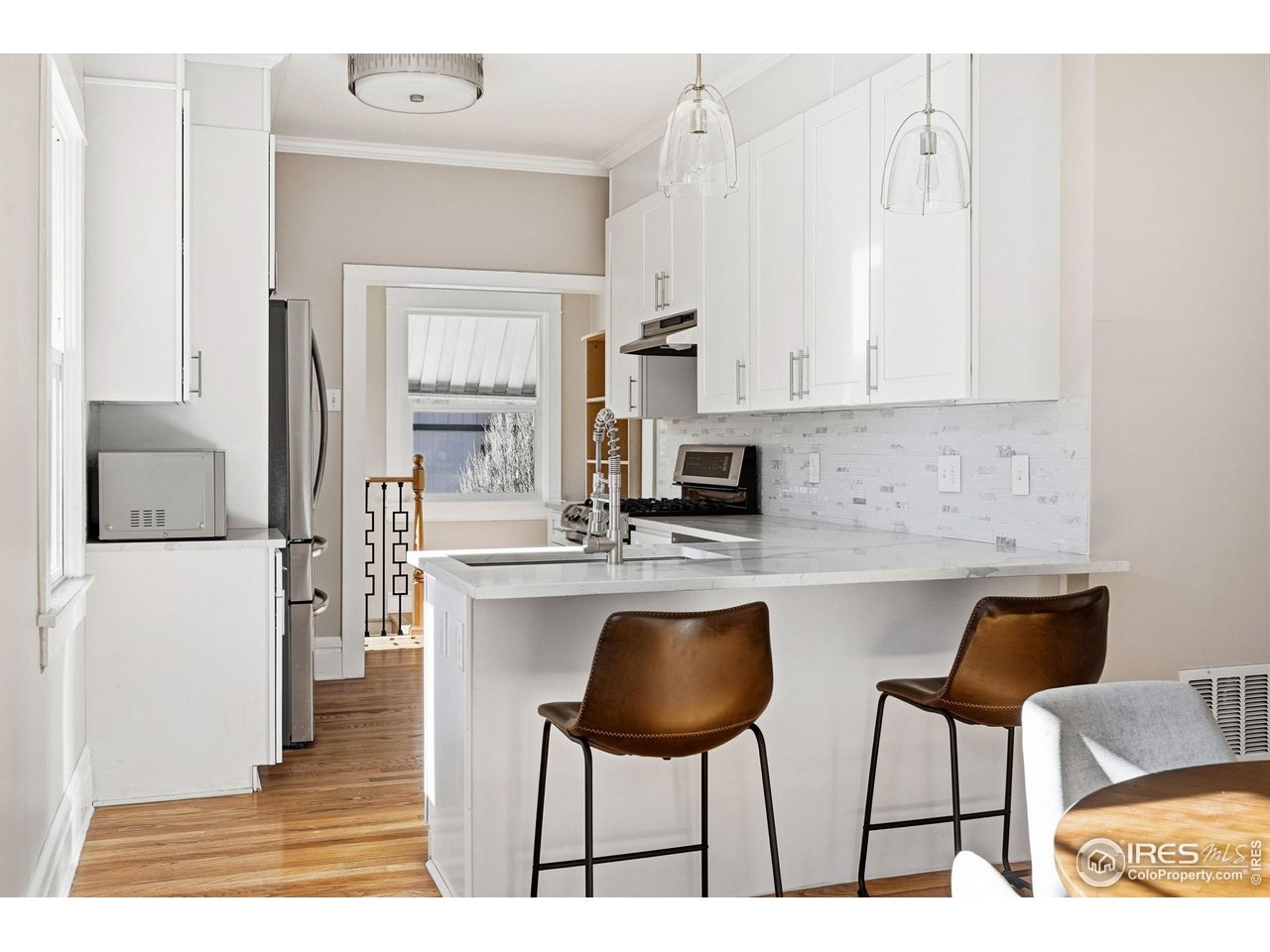 2065 Holly Street Denver, CO 80207 - Photo 5 of 46 Chef's Kitchen with quartz counters, LG Appliances