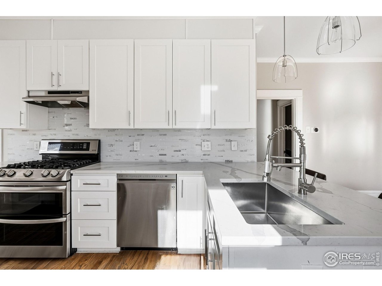 2065 Holly Street Denver, CO 80207 - Photo 6 of 46 Chef's Kitchen with quartz counters, LG Appliances