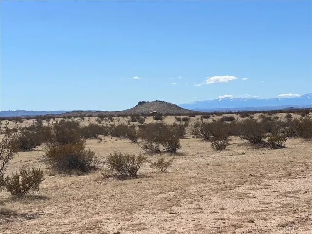 a view of mountain view with mountains in the background