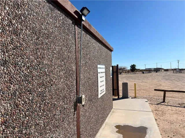 a view of a door and wooden fence