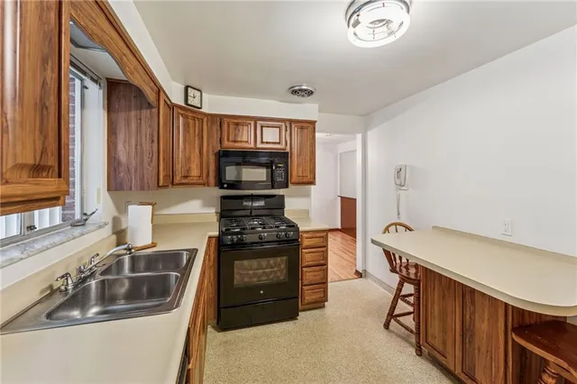 a kitchen with a stove and a sink