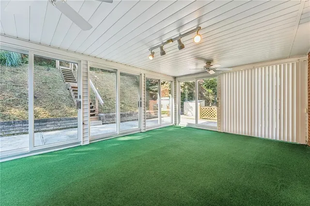 a view of an empty room with windows