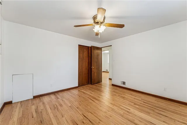 a view of room with wooden floor