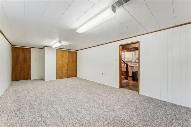 a front view of a house with glass doors