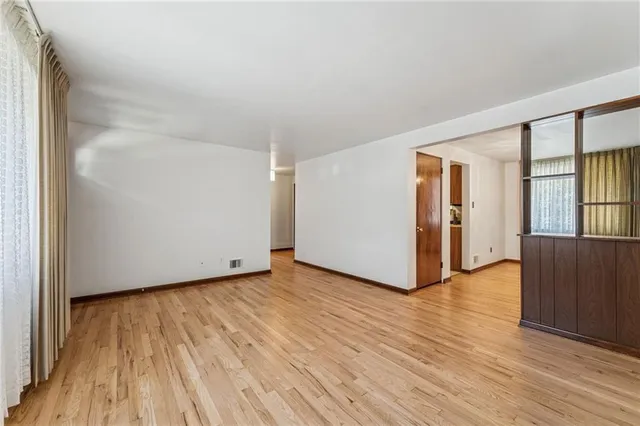 a view of a livingroom with wooden floor