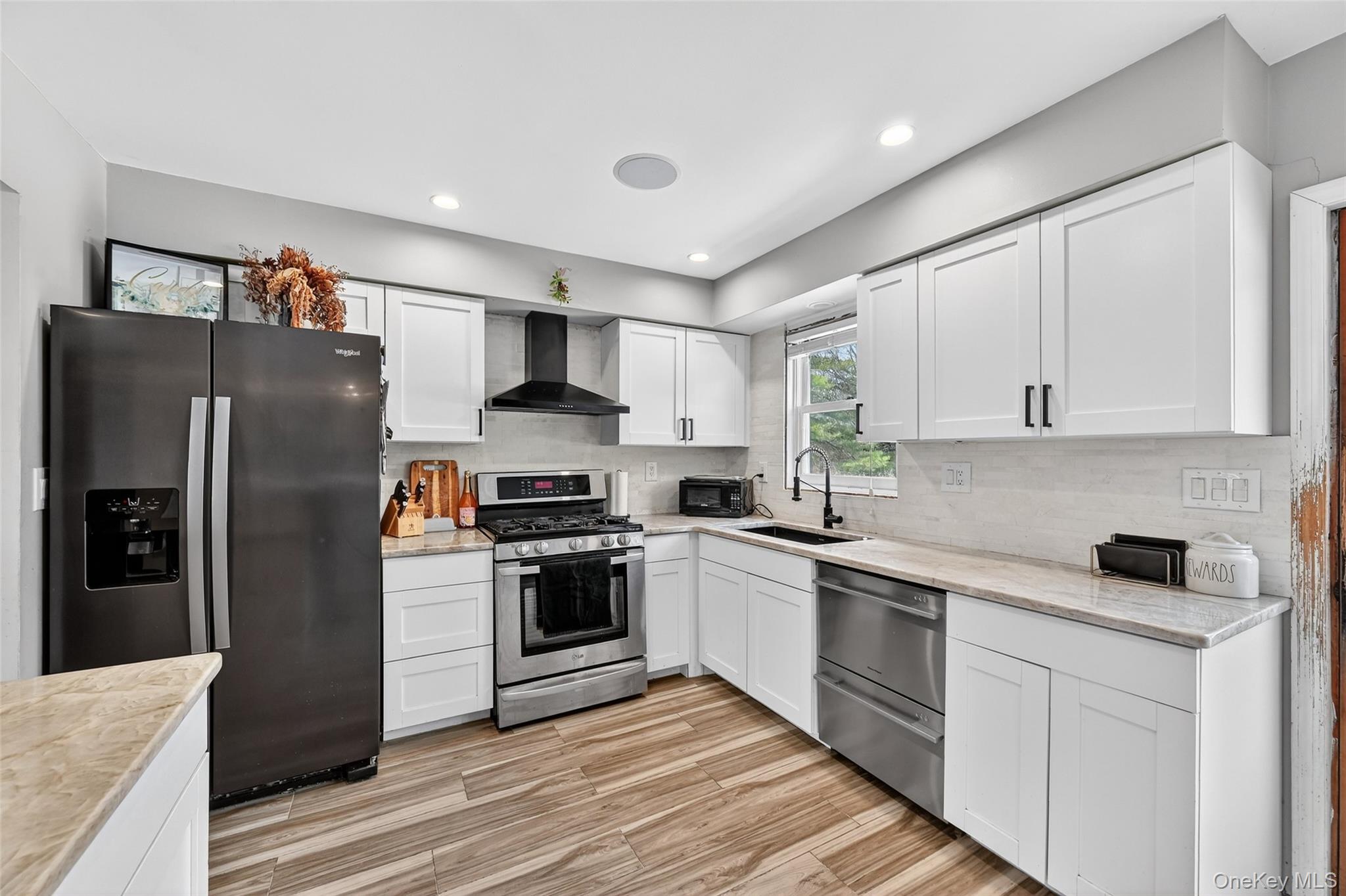 917 Scotchtown Collabar Road Middletown, NY 10941 - Photo 13 of 33 a kitchen with stainless steel appliances a refrigerator sink and stove