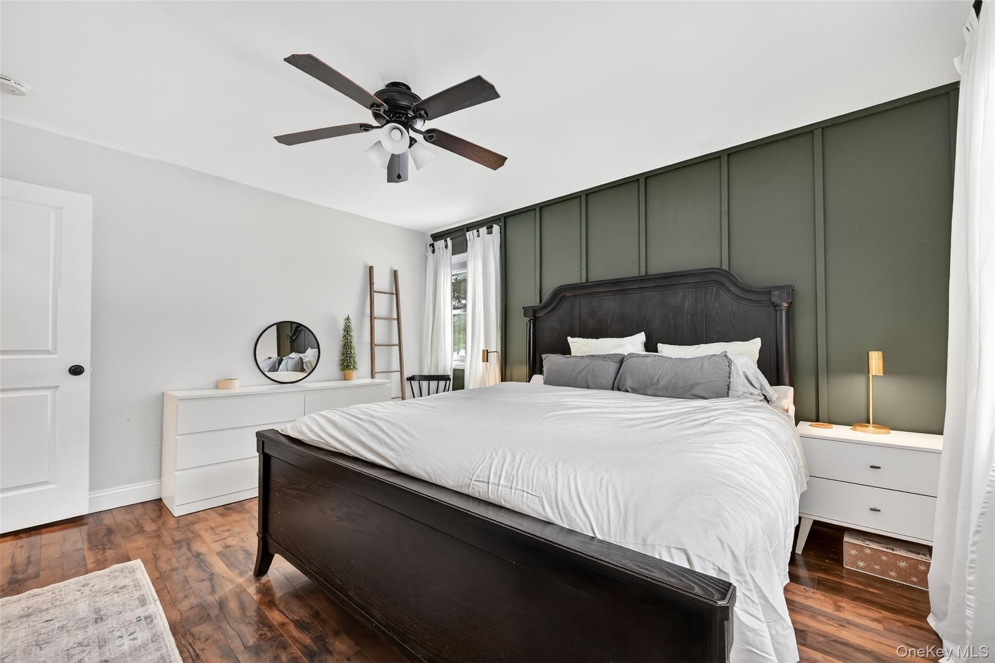 917 Scotchtown Collabar Road Middletown, NY 10941 - Photo 20 of 33 a bedroom with a bed and a chandelier